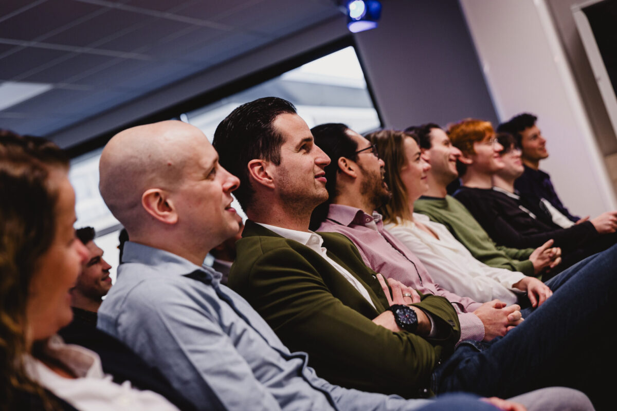 People in a row in the SUE theatre.
