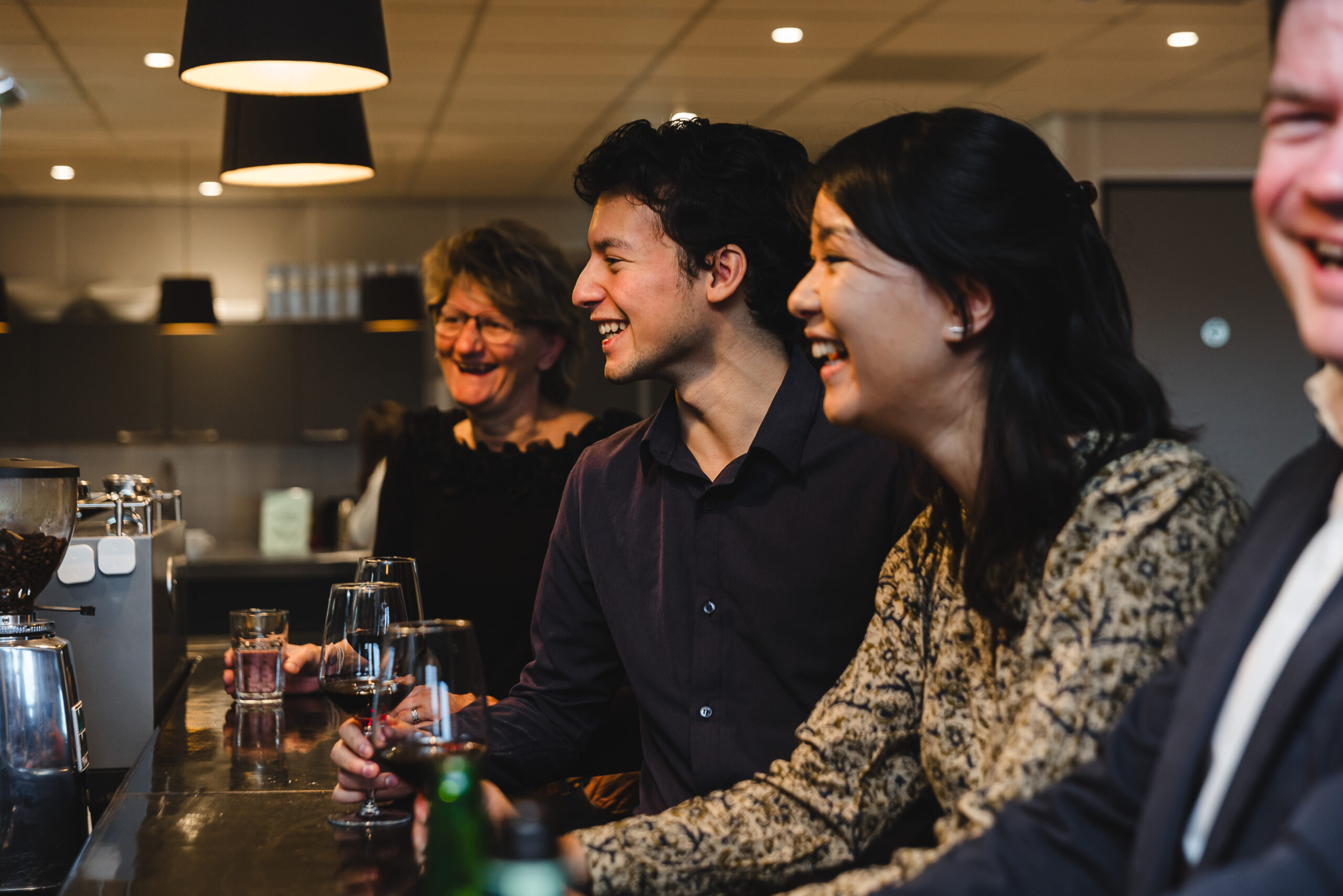 People sitting at a bar.